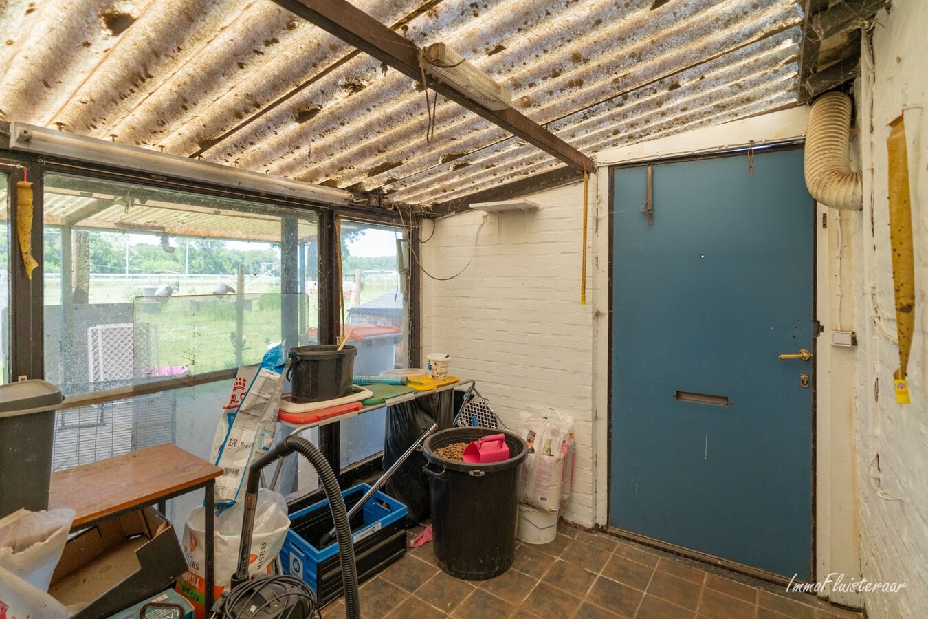 Te renoveren woning met grond op ca. 33 are te Kinrooi 