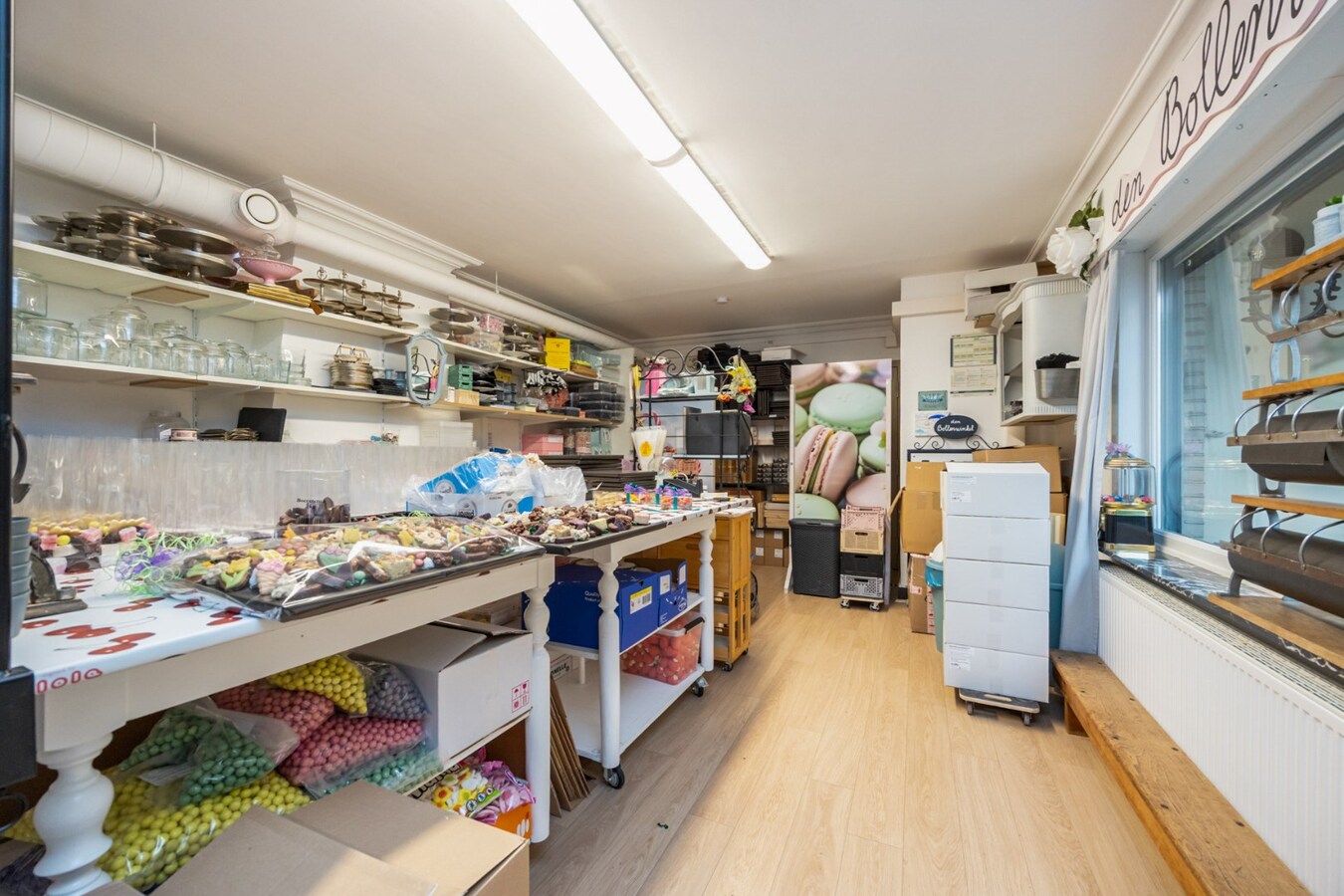 Interessante investeringsopportuniteit in hartje Malle: handelspand + 2 appartementen 