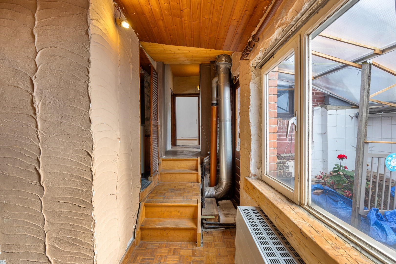 Halfopen hoekwoning met garage en dakterras op toplocatie in Kessel-Lo – renovatieproject met veel potentieel 