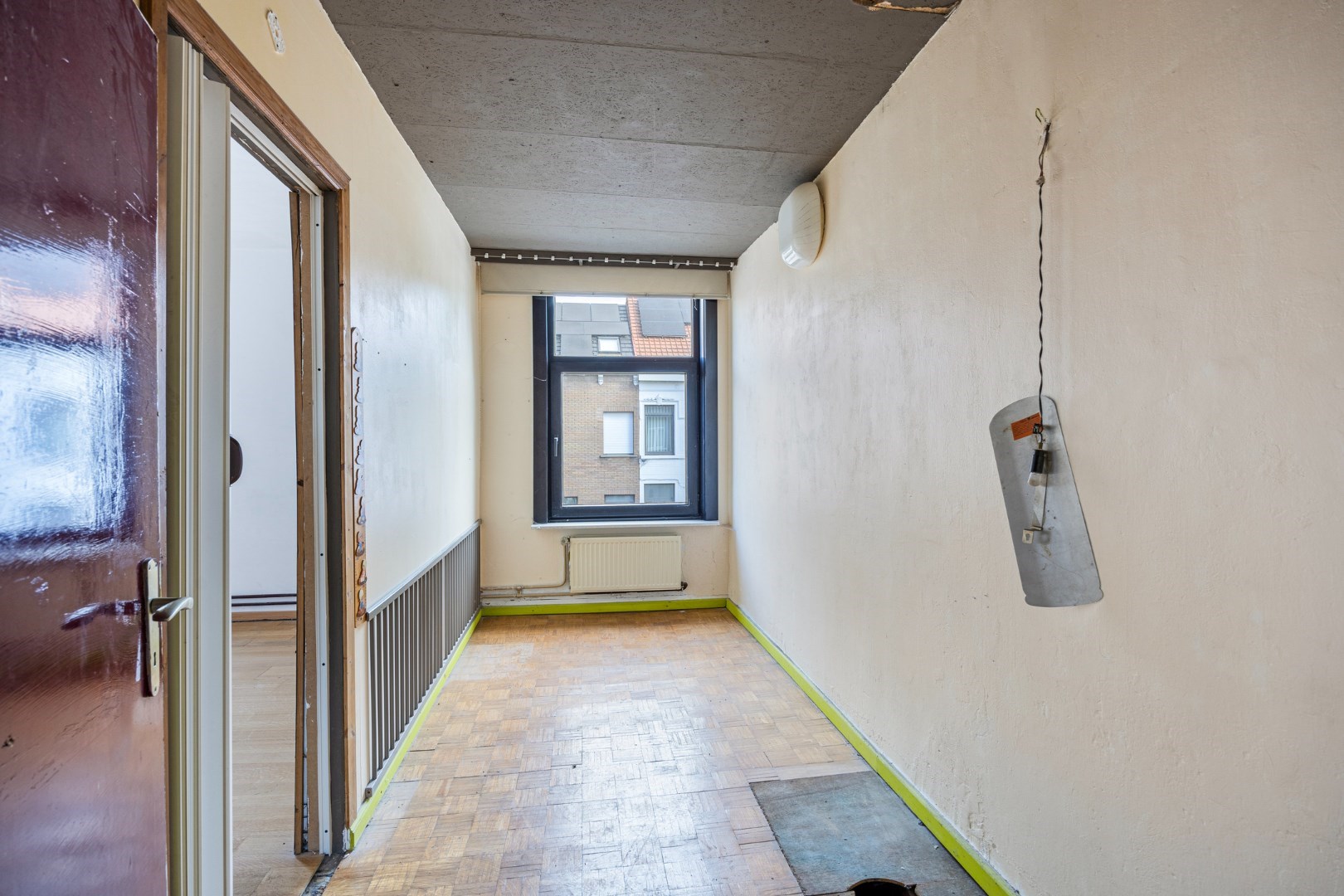Halfopen hoekwoning met garage en dakterras op toplocatie in Kessel-Lo – renovatieproject met veel potentieel 