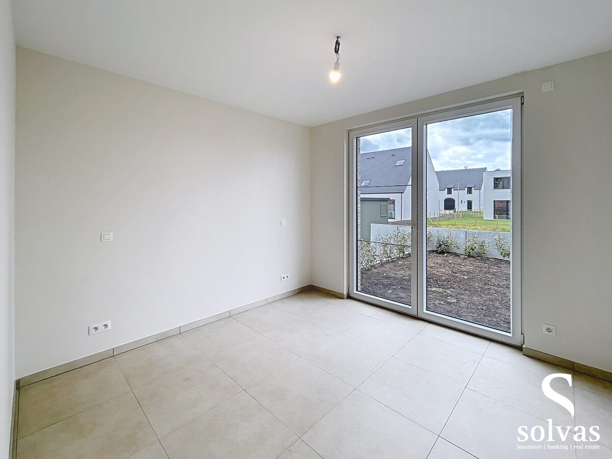 Ruim nieuwbouwappartement met tuin, terras, garage en 3 slaapkamers op prachtige locatie (Vaart) te Bellem 