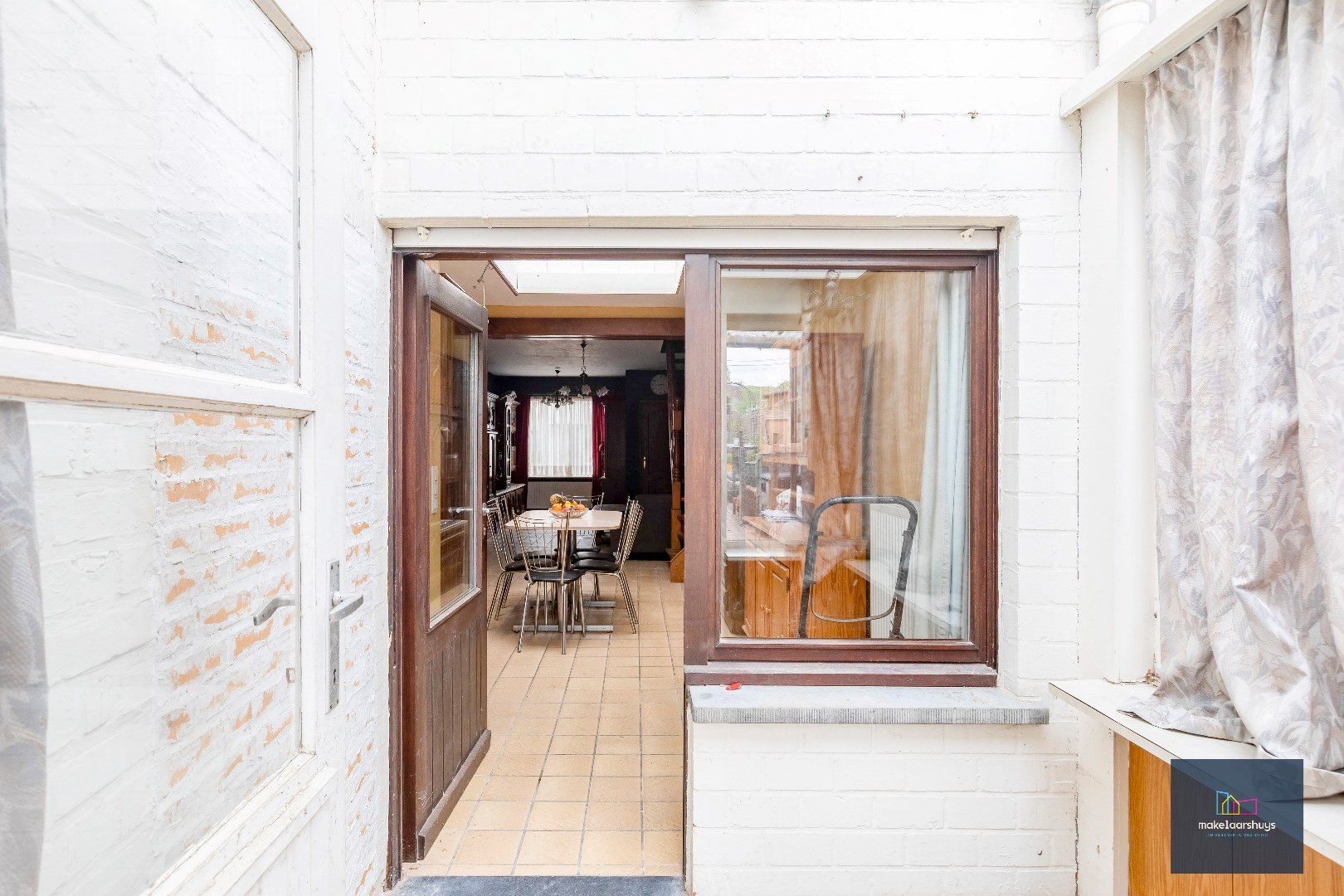 Rijwoning met tuin te Wetteren. 