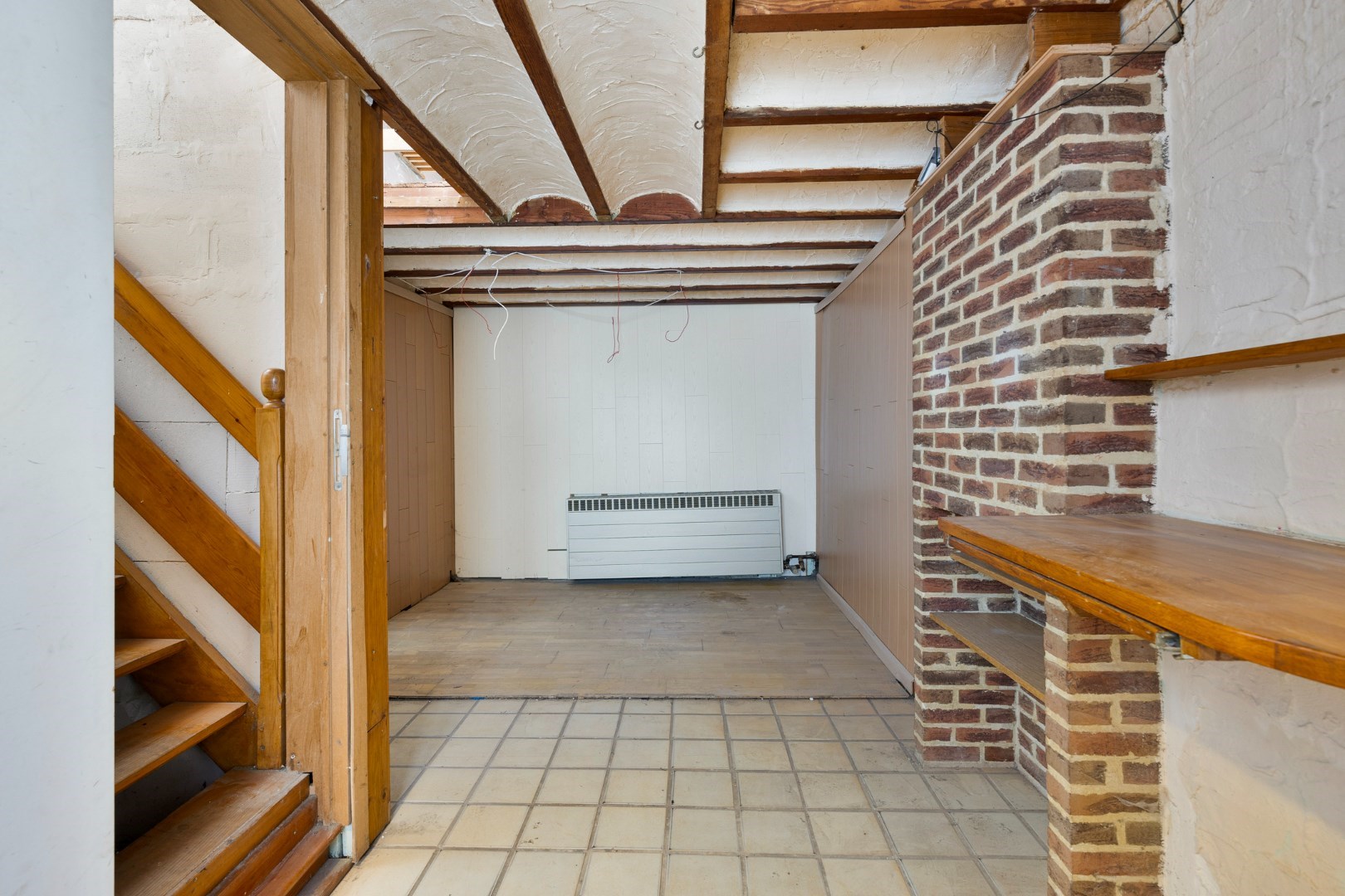 Halfopen hoekwoning met garage en dakterras op toplocatie in Kessel-Lo – renovatieproject met veel potentieel 
