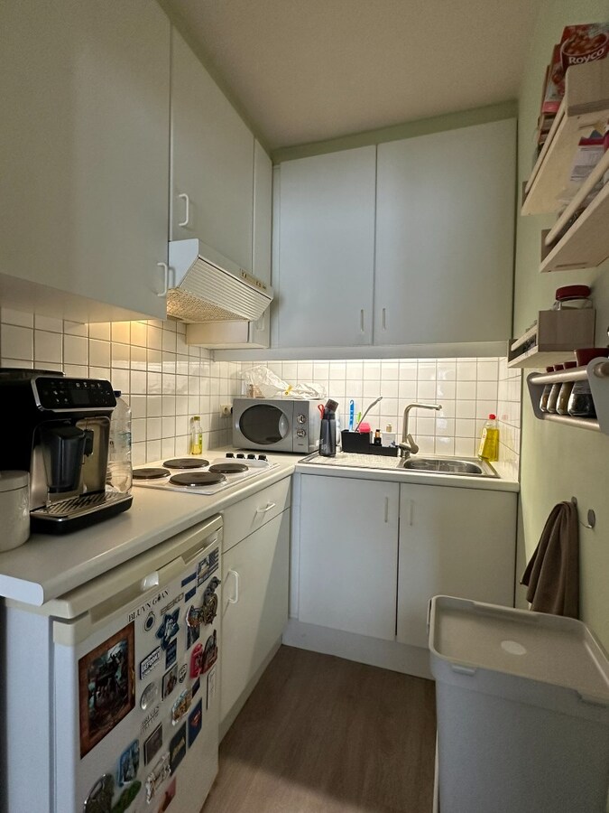 Interessante investeringsopportuniteit in hartje Malle: handelspand + 2 appartementen 