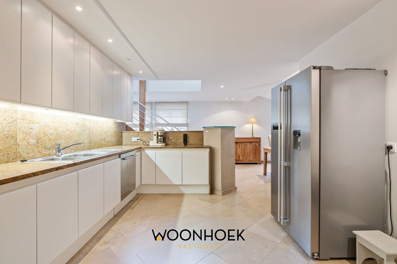 Centraal gelegen woning met handelsruimte te Lokeren 