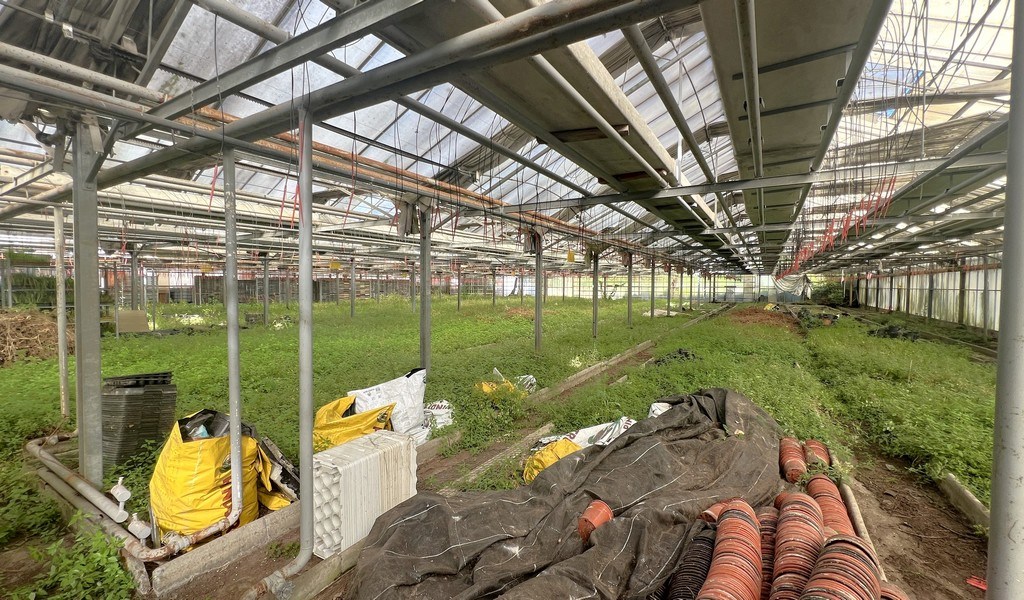 Agrarische grond met serres te koop in Merelbeke