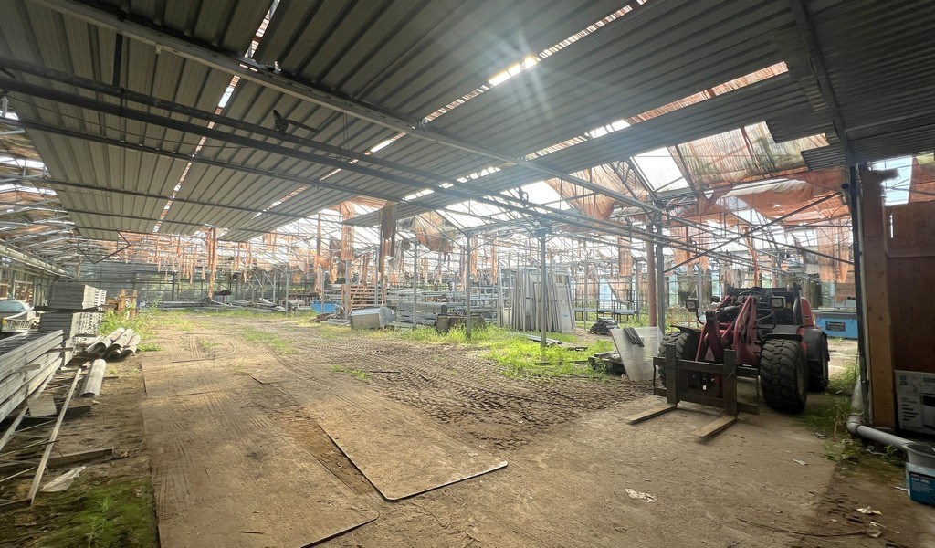 Agrarische grond met serres te koop in Merelbeke