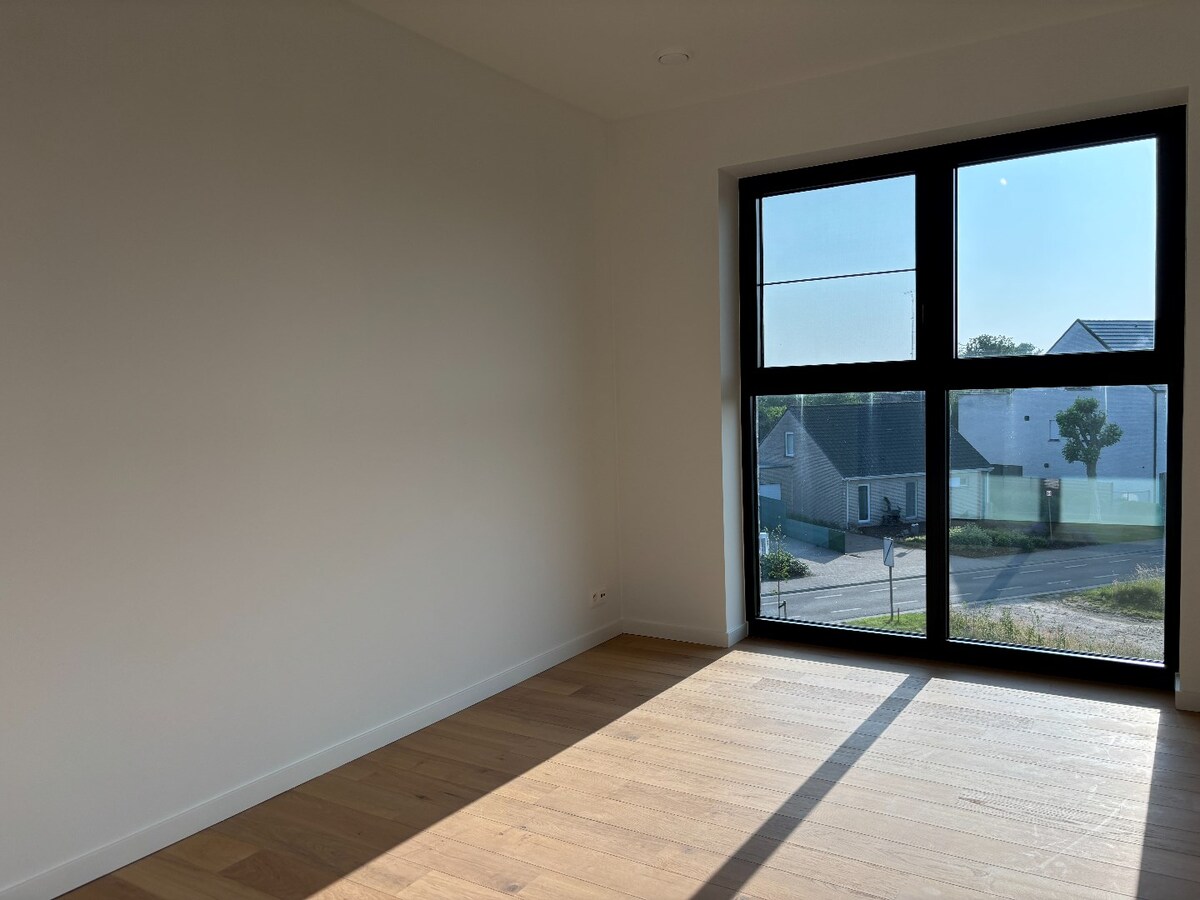 Stijlvol nieuwbouwappartement met zonneterras en garage in het hart van Sint-Antonius 