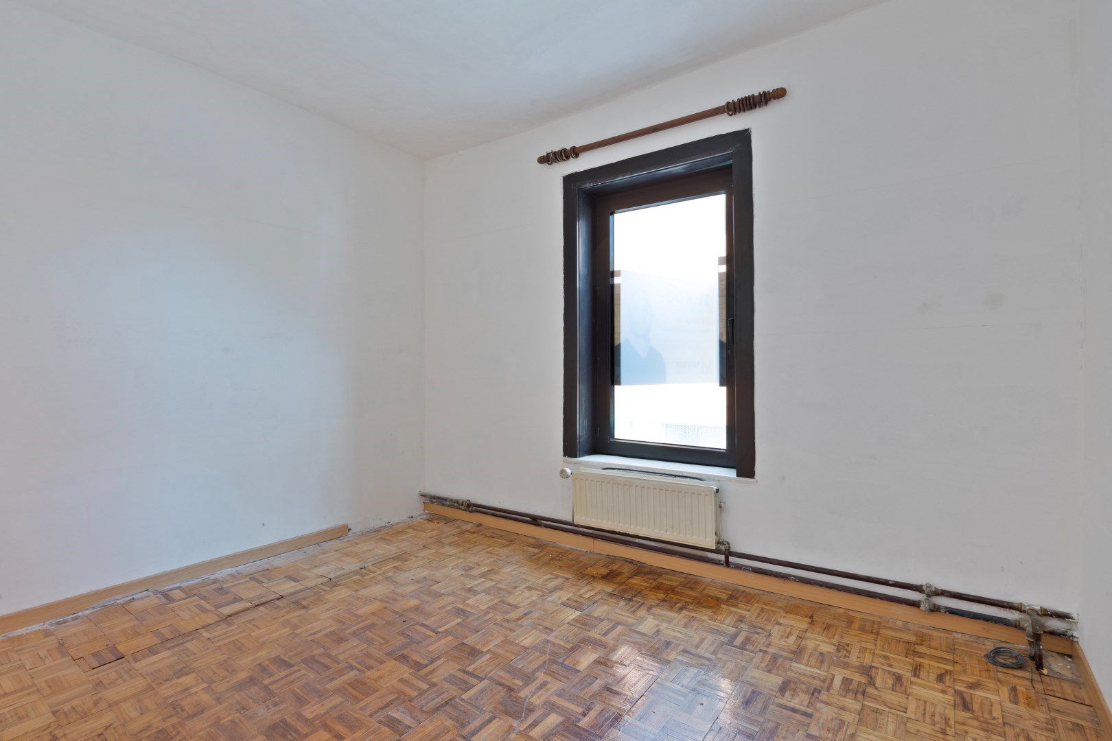 Halfopen hoekwoning met garage en dakterras op toplocatie in Kessel-Lo – renovatieproject met veel potentieel 