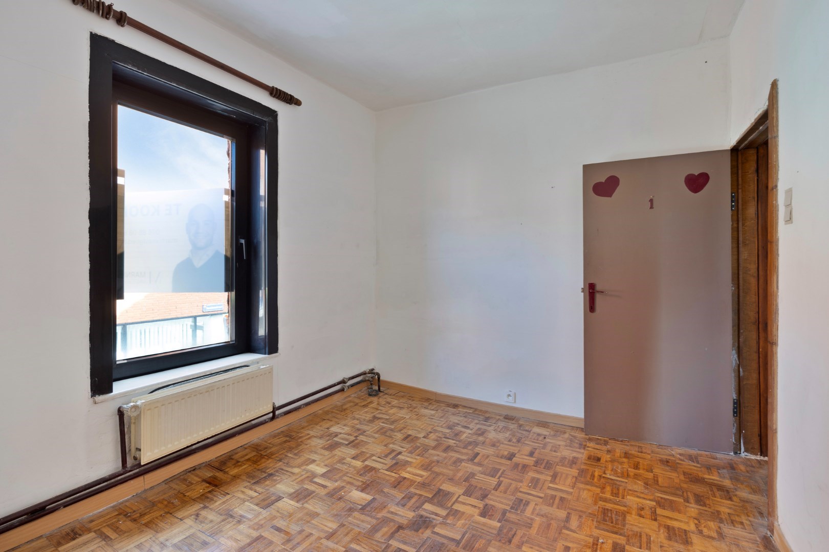 Halfopen hoekwoning met garage en dakterras op toplocatie in Kessel-Lo – renovatieproject met veel potentieel 