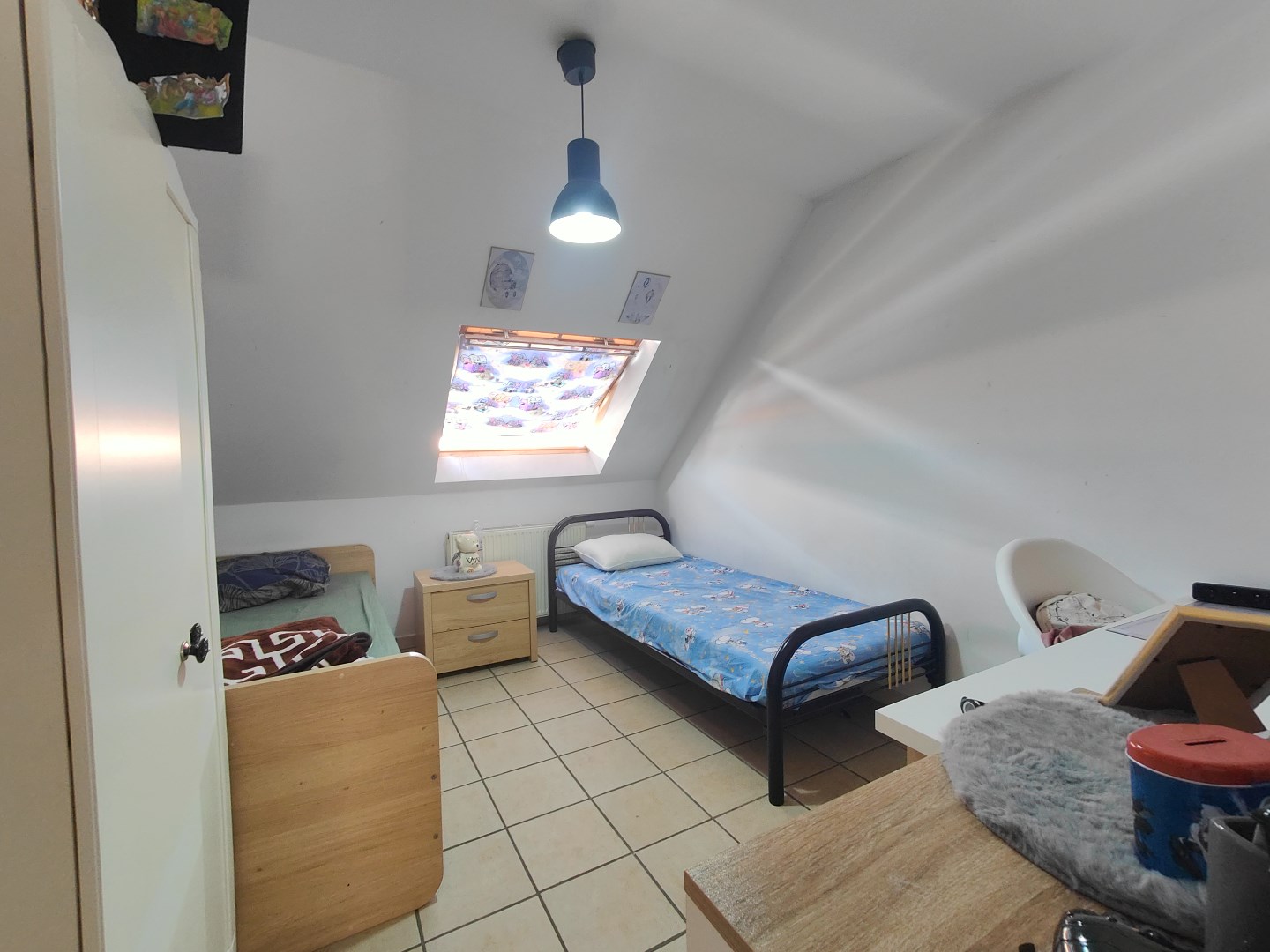 Ruime woning met achterliggende tuin en inpandige garage 