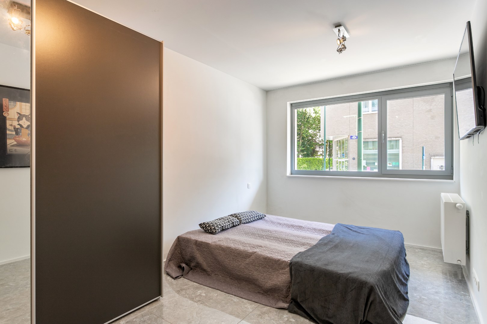 Recent gelijkvloersappartement met TUIN, 2 slaapkamers, terras en kelderberging 