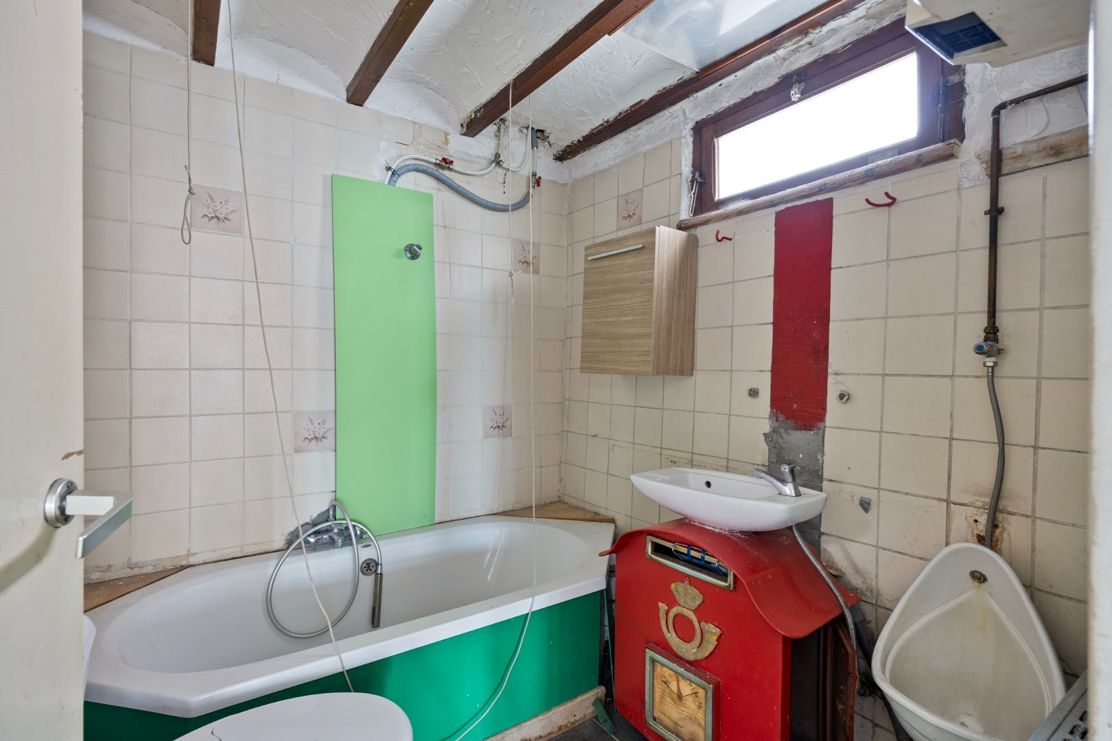 Halfopen hoekwoning met garage en dakterras op toplocatie in Kessel-Lo – renovatieproject met veel potentieel 