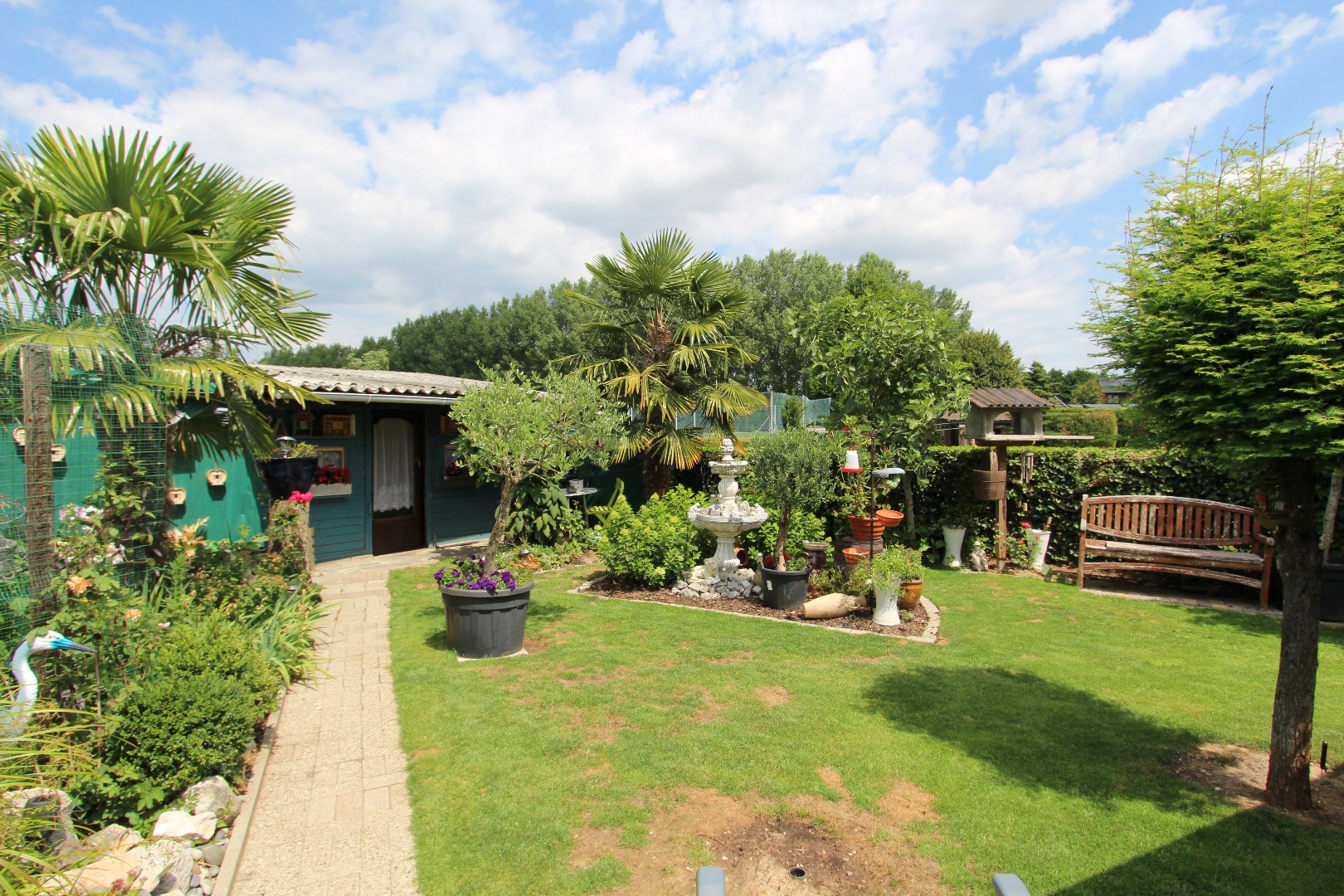 Charmante woning met veranda en mooie tuin in een rustige, landelijke omgeving 
