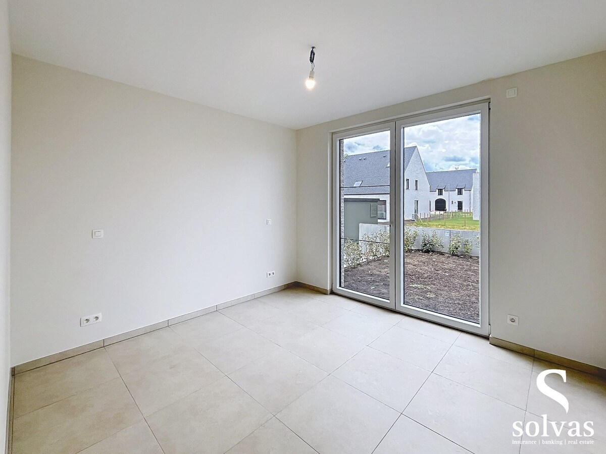Ruim nieuwbouwappartement met tuin, terras, garage en 3 slaapkamers op prachtige locatie (Vaart) te Bellem 